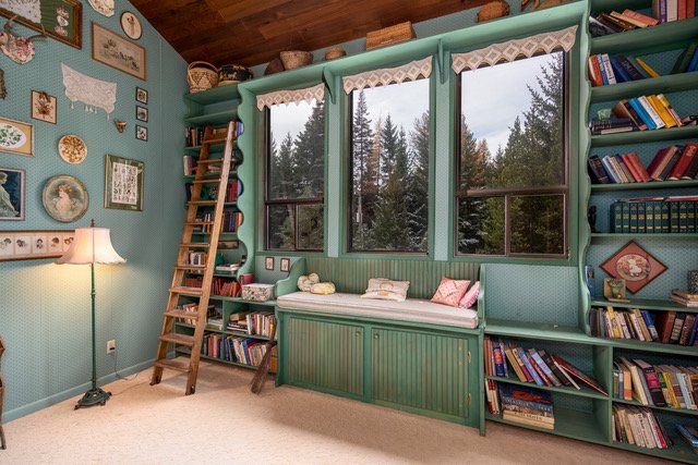 Built-in library with rolling ladder and window seat